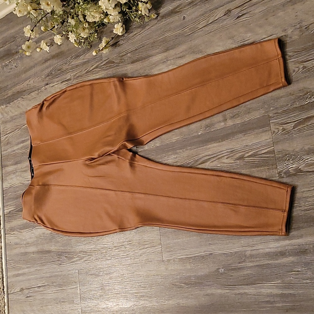 NWOT, Tan faux leather like pull on pants/leggings in a sz. 2 (18-20).